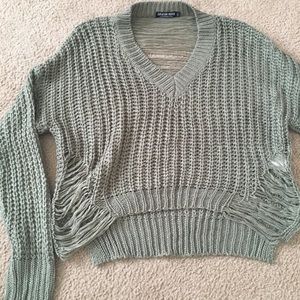 Cropped distressed sweater